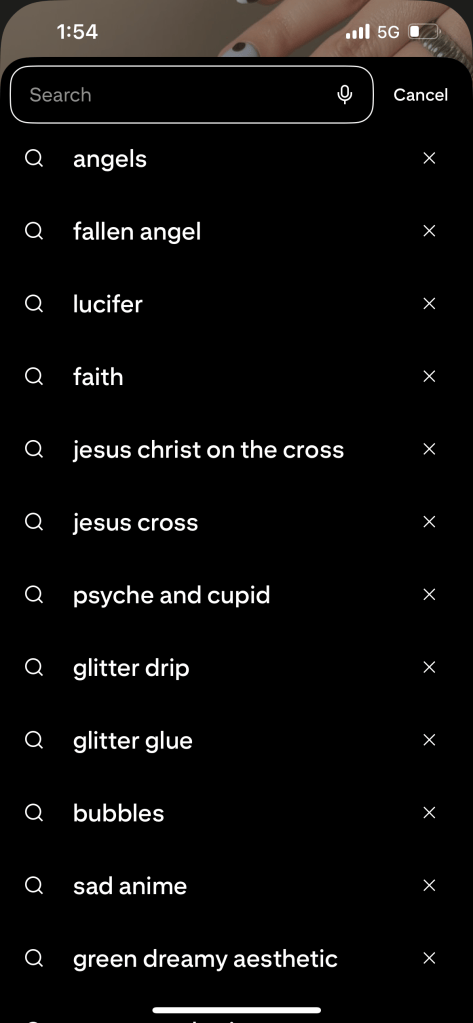 A close-up of a hand with black nails against a brown background, featuring a search interface with various keywords related to themes of angels, faith, and aesthetics.